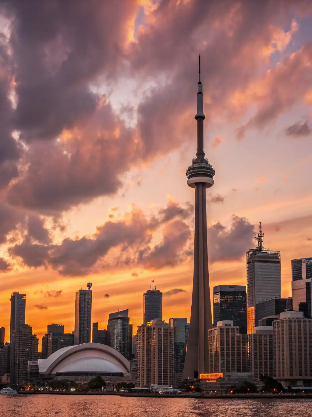 A vibrant photo of the Toronto skyline with the CN Tower prominently featured, reflecting Canada's diverse and dynamic business environment.